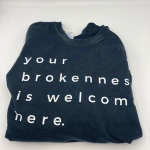 “Your brokenness is welcome here” black shirt